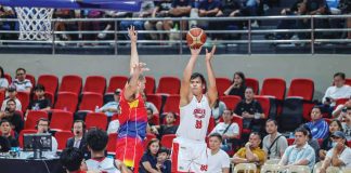 Barangay Ginebra San Miguel Kings’ Benedict Adamos pulls up for a shot against the defense of Phoenix Fuel Masters’ Jason Perkins. PBA PHOTO
