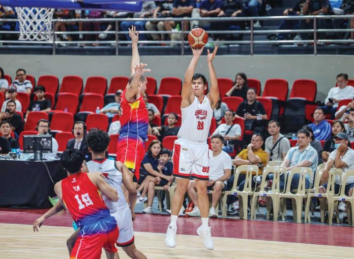 sports-Ginebra-1 Barangay Ginebra San Miguel Kings’ Benedict Adamos pulls up for a shot against the defense of Phoenix Fuel Masters’ Jason Perkins. PBA PHOTO