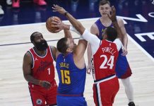Denver Nuggets’ Nikola Jokic attempts to score against the defense of Los Angeles Clippers' Norman Powell. AP