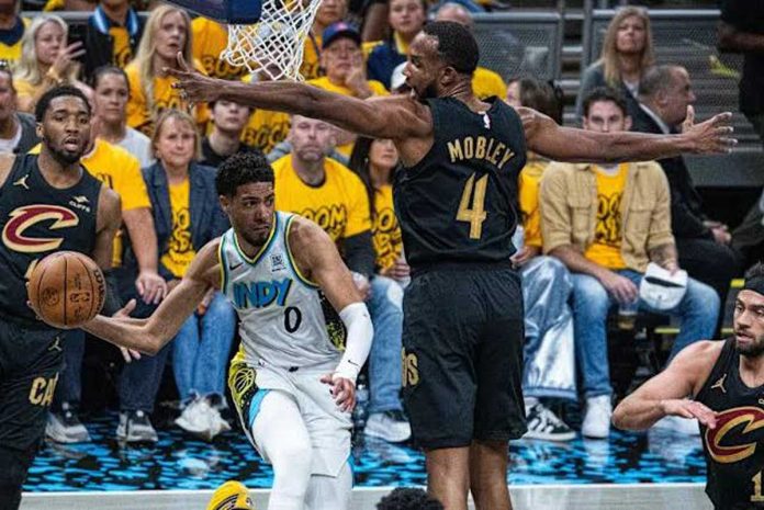 sports-NBA Indiana Pacersā Tyrese Haliburton looks to pass the ball after being defended by Cleveland Cavaliersā Evan Mobley. AP PHOTO