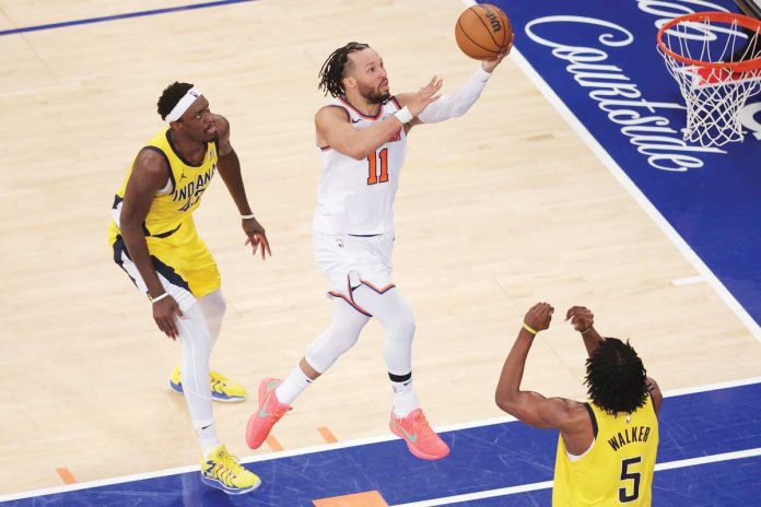 sports-NBA New York Knicks guard Jalen Brunson (11) shoots against Indiana Pacers forward Pascal Siakam (43) and forward Jarace Walker (5). BRAD PENNER-IMAGN IMAGES