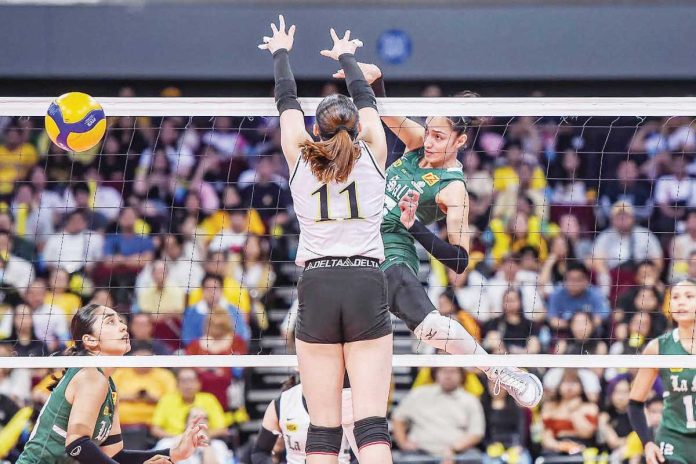 sports_DLSU_resized Ilongga Amie Provido of De La Salle University Lady Spikers scores against the defense of University of Santo Tomas Golden Tigresses’ Pia Abbu. UAAP PHOTO
