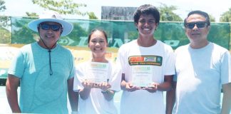 Kathryn Bugna (second from left) flashes a proud smile after pulling off another impressive three-title sweep in Aklan. Joining her are (from left) coach Ronald Martin, boys’ MVP Rizzjun Labindao and Dr. Rizzel Labindao. CONTRIBUTED PHOTO