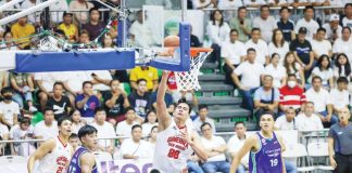 Barangay Ginebra San Miguel Kings’ Benedict Adamos scores against the defense of Converge FiberXers' Kevin Racal. PBA PHOTO