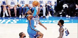 Oklahoma City Thunder's Shai Gilgeous-Alexander (2) shoots the ball against Minnesota Timberwolves' Mike Conley (10). PHOTO COURTESY OF ALONZO ADAMS/IMAGN IMAGES