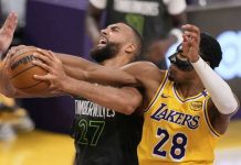 Minnesota Timberwolves Rudy Gobert battles Los Angeles Lakers' Rui Hachimura for the rebound. AP