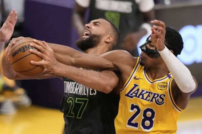 sports_NBA_resized Minnesota Timberwolves Rudy Gobert battles Los Angeles Lakers' Rui Hachimura for the rebound. AP