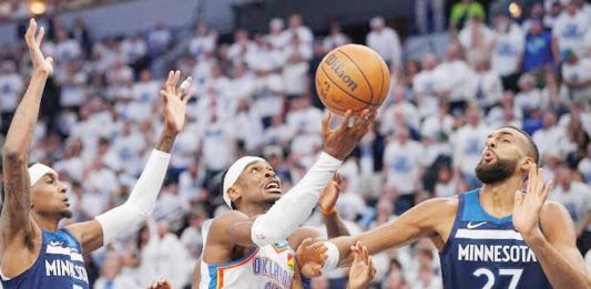 Oklahoma City Thunder’s Shai Gilgeous-Alexander goes for a layup against the defense of Minnesota Timberwolves’ Rudy Gobert. PHOTO COURTESY OF USA TODAY