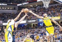 Indiana Pacers’ Myles Turner and Obi Toppin tries to reach the ball for the rebound. PHOTO COURTESY OF INDY STAR