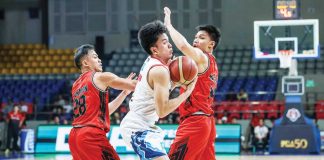 Rain or Shine Elasto Painters’ Adrian Nocum attempts to elude the double teaming defense of Blackwater Bossing. PBA PHOTO