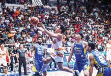 Rain or Shine Elasto Painters’ Andrei Caracut eludes his Magnolia Chicken Timplados Hotshots’ defenders for a layup. PBA PHOTO