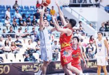 TNT Tropang 5G’s Roger Pogoy attacks the defense of Rain or Shine Elasto Painters’ Leonard Santillan. PBA PHOTO