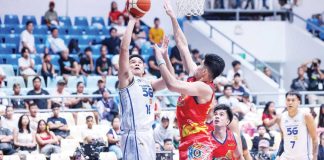 TNT Tropang 5G’s Roger Pogoy attacks the defense of Rain or Shine Elasto Painters’ Leonard Santillan. PBA PHOTO