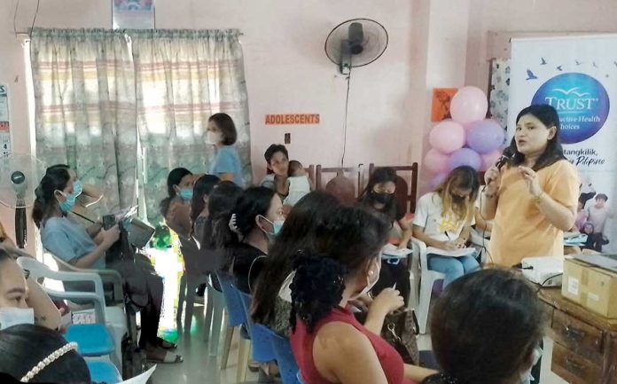 Personnel of the Iloilo City Health Office (CHO) provide health education on safe motherhood. The CHO warns that the prevalence of early pregnancies could worsen without proper sex education, open family discussions, and stronger community engagement. ILOILO CITY HEALTH OFFICE PHOTO