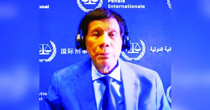 Duterte now copy_superimposed File photo of former President Rodrigo Roa Duterte during his initial appearance at the International Criminal Court on March 14, 2025, in The Hague.