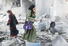 Hamas offers to free 10 hostages but wants tweaks in US truce plan Palestinians inspect the damage at the site of an Israeli strike on a house in Jabalia, northern Gaza. REUTERS