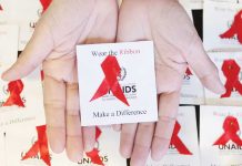 The red ribbon is a recognized symbol for HIV and AIDS awareness used in campaigns to support people living with the disease. MARIANNE BERMUDEZ, PHILIPPINE DAILY INQUIRER