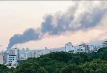 Smoke billowed from the headquarters of Iran's state broadcaster following the Israeli air strike. AFP