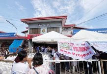 Agriculture Secretary Francisco Tiu Laurel Jr. and Bacolod City officials lead the launch of the P20-per-kilo rice program at Burgos Market on June 5, 2025.