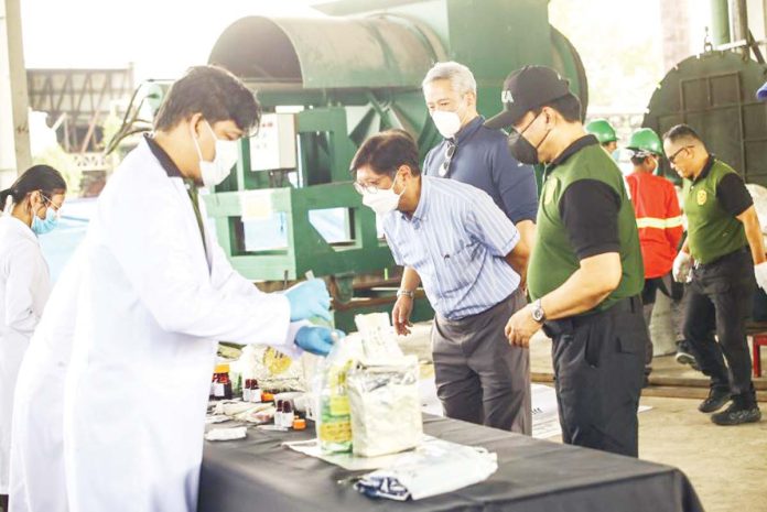 PBBM-copy President Ferdinand R. Marcos Jr. (center) checks some of the 1,530 kilograms of prohibited substances worth P9.4 billion incinerated at waste management firm Clean Leaf International Corp. in Barangay Cutcut, Capas, Tarlac on Wednesday, June 25, 2025. Among the drugs destroyed were 1,304 kg of shabu valued at P8.8 billion, some recovered floating in waters off Zambales, Pangasinan, Ilocos Norte, Ilocos Sur and Cagayan provinces. PNA