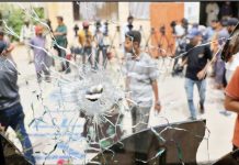 More than 200 inmates escape Pakistan jail after earthquake Men in plain clothes and some in police uniform are seen through a broken jail glass window with a hole created by some sort of impact in Pakistan. Inmates broke down doors and locks of their cells and shattered windows before storming the prison gates. REUTERS