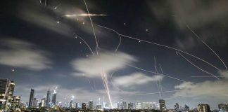 The Israeli Iron Dome air defense system fires to intercept missiles during an Iranian attack over Tel Aviv, Israel. AP