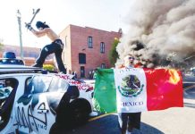 Unlawful assembly declared in downtown LA to quell protests A demonstrator hits a Waymo self-driving car with his skateboard during a protest against federal immigration sweeps in downtown Los Angeles on June 8. REUTERS