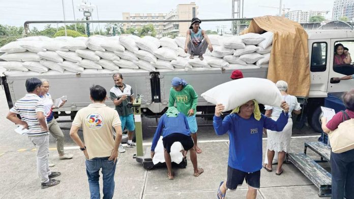 bacolod-P20-rice-pic-1 Sacks of well-milled rice are being prepared for the launching of the P20 per kilo rice project of the Department of Agriculture and Kadiwa ng Pangulo at Burgos Market in Bacolod City today, June 5, 2025. BACOLOD CITY PIO PHOTO