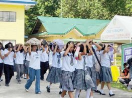 Students of Tigbauan National High School cover their heads with bags and books as they evacuate to safety during the simulated magnitude 7.2 earthquake, held under the 2nd Quarter Nationwide Simultaneous Earthquake Drill in Tigbauan, Iloilo. PHOTO FROM CIVIL DEFENSE WESTERN VISAYAS FACEBOOK