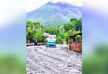Mount Kanlaon remains under Alert Level 3, indicating a state of heightened or magmatic unrest. File photo shows floodwaters and mudflow along the highway in Sitio Tamburong, Barangay Biak-na-Bato, La Castellana, Negros Occidental. LA CASTELLANA MDRRMO/MJ GUARDIANO PHOTO