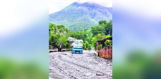 Mount Kanlaon remains under Alert Level 3, indicating a state of heightened or magmatic unrest. File photo shows floodwaters and mudflow along the highway in Sitio Tamburong, Barangay Biak-na-Bato, La Castellana, Negros Occidental. LA CASTELLANA MDRRMO/MJ GUARDIANO PHOTO
