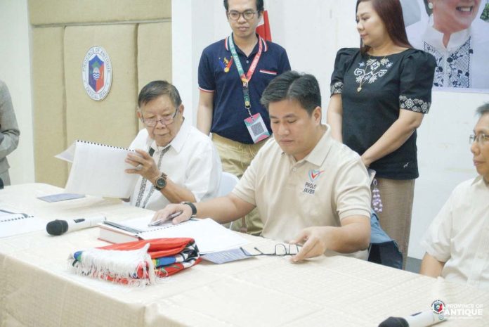 Antique’s Governor-elect Paolo Javier (seated, right) outlines his vision and immediate priorities for the province during a symbolic turnover ceremony on June 27, 2025 at the New Capitol. Also in photo is outgoing Provincial Administrator Atty. Nery Duremdes (left), who represented outgoing Gov. Rhodora Cadiao. PROVINCE OF ANTIQUE/FACEBOOK PHOTO