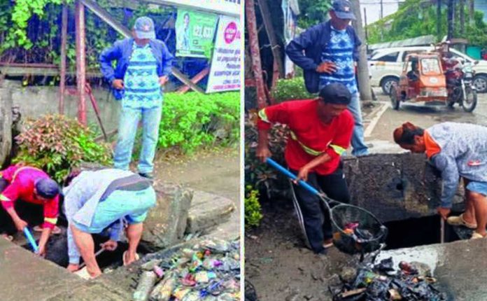 mai-waste-copy_superimposed Workers retrieve heaps of plastic bottles and debris from a drainage outfall in Iloilo City, as part of intensified efforts to reduce daily waterway pollution that now exceeds 700 kilos. ILOILO CITY ENGINEER OFFICE PHOTO