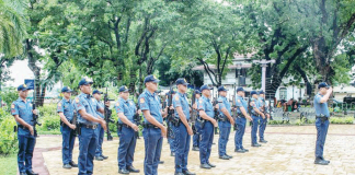 Police officers of the Iloilo City Police Office (ICPO) stand in formation at Plaza Libertad during the 127th Independence Day celebration. The ICPO is now reinforcing its wellness and fitness programs after 98 of its personnel were recently classified as obese. ICPO PHOTO