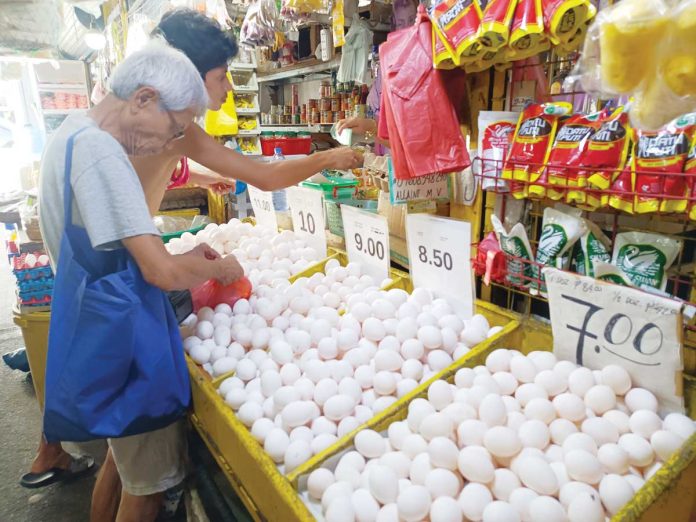 Data from the Philippine Statistics Authority showed that food inflation in May 2025 remained at 0.7 percent. Photo shows a senior citizen buying eggs at a stall in La Paz Public Market in Iloilo City. AJ PALCULLO/PN