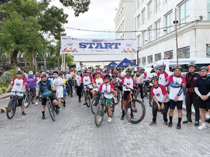 neljoy-bike-copy Cyclists gather at the starting line in front of the Iloilo Provincial Capitol for the BISIG-Kleta: Bike Ride for a Cause on June 15, 2025, showing their united support for legal adoption and a loving home for every child. The event was part of the 3rd Adoption and Alternative Child Care Week celebration. PHOTO FROM RACCO-VI
