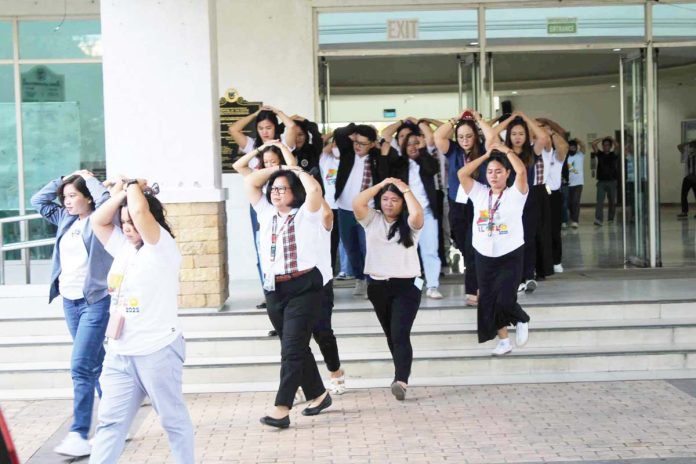 Capitol personnel evacuate the Iloilo Provincial Government building during a full-scale earthquake drill on June 24, 2025, simulating a 6.9-magnitude tremor with multiple casualties as part of intensified disaster preparedness efforts. AJ PALCULLO/PN