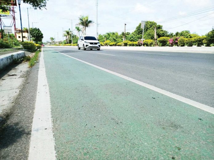 A newly constructed three-kilometer bike lane in Barangay Mali-ao, Pavia, Iloilo offers cyclists a safer and more accessible route along the national road, part of a sustainable transport initiative by the Department of Public Works and Highways and the local government of Pavia. AJ PALCULLO/PN