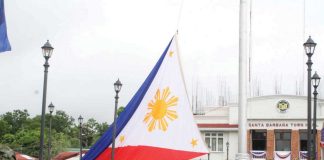 A giant Philippine flag is hoisted at the historic Santa Barbara town plaza in Iloilo Province on June 12, 2025, marking the 127th Independence Day and honoring the site where the national flag was first raised outside Luzon in 1898. AJ PALCULLO/PN