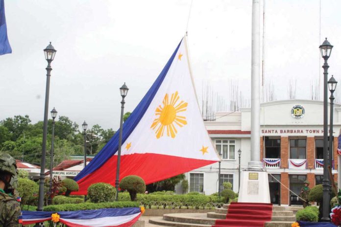 neljoy_santa_barbara_resized A giant Philippine flag is hoisted at the historic Santa Barbara town plaza in Iloilo Province on June 12, 2025, marking the 127th Independence Day and honoring the site where the national flag was first raised outside Luzon in 1898. AJ PALCULLO/PN
