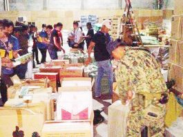 Authorities arrested two persons and confiscated over P5 million worth of smuggled cigarettes during an operation in Fullway Industrial Park, Barangay Tacas, Jaro, Iloilo City, on June 18, 2025. REGIONAL MARITIME UNIT 6 PHOTO