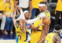 Oklahoma City Thunder guard Shai Gilgeous-Alexander tries to shoot between Indiana Pacers guard Andrew Nembhard (2) and center Myles Turner. AP Photo/Abbie Parr
