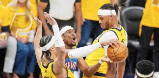 Oklahoma City Thunder guard Shai Gilgeous-Alexander tries to shoot between Indiana Pacers guard Andrew Nembhard (2) and center Myles Turner. AP Photo/Abbie Parr