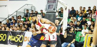 San Miguel Beermen's Moala Tautuaa attacks the defense of Rain or Shine Elasto Painters' Caelan Tiongson. PBA PHOTO