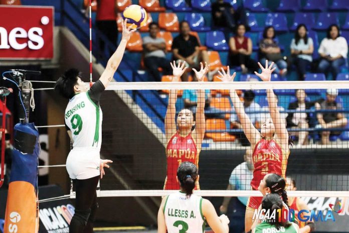 sports_CSB_resized College of St. Benilde Lady Blazers’ Aya Densing drops the ball against the defense of Mapua University Lady Cardinals. PHOTO COURTESY OF NCAA/GMA SPORTS