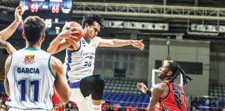 Converge FiberXers’ Bryan Santos grabs the rebound as San Miguel Beermen’s Jaymar Perez looks on. PBA PHOTO