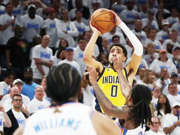 sports_NBA_1_resized Indiana Pacers’ Tyrese Haliburton connects a game-winning basket against the defense of Oklahoma City Thunder's Cason Wallace. GETTY IMAGES