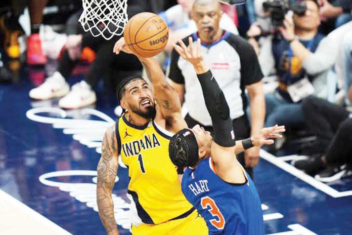 sports_NBA_1_resized Indiana Pacers' Obi Toppin foils the shot attempt of New York Knicks' Josh Hart. AP PHOTO