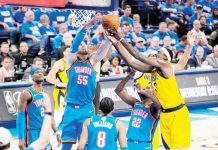 Oklahoma City Thunder's Isaiah Hartenstein (55) and Indiana Pacers' Myles Turner (33) and Pascal Siakam (43) battle for the rebound. PHOTO BY KYLE TERADA-IMAGN IMAGES