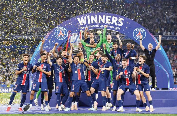 sports_PSG_resized Paris Saint-Germain FC celebrate their UEFA Champions League win. PSG PHOTO